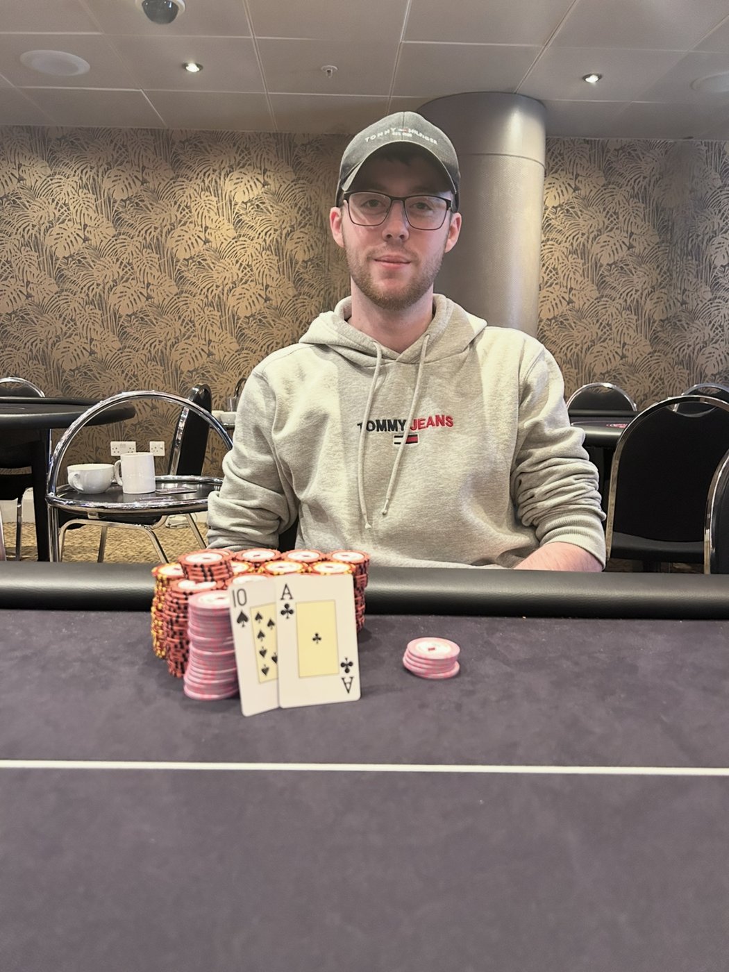 At the poker table with my chips and cards