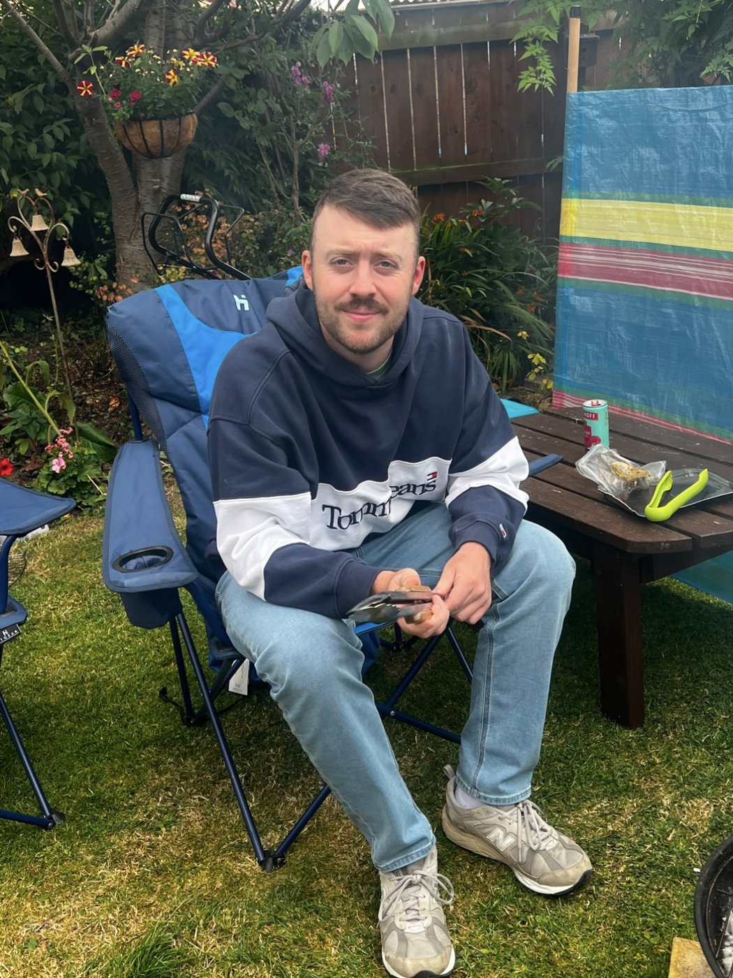 Sitting by the barbecue in the garden